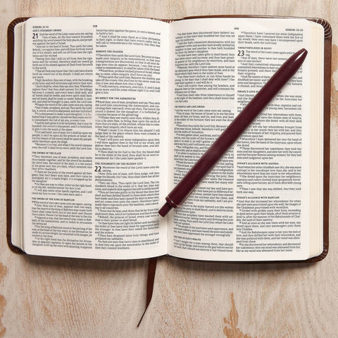 Inside of Bible compared to size of pen