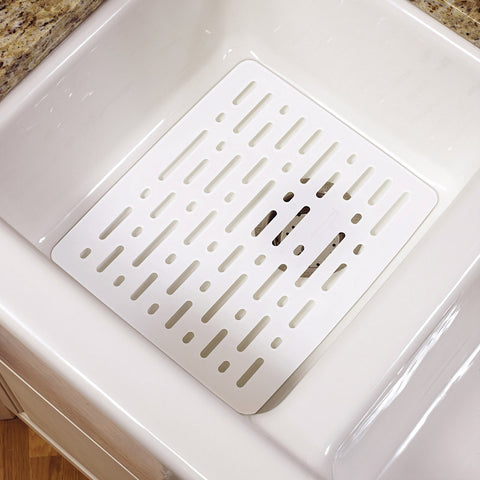 White plastic sink mat.