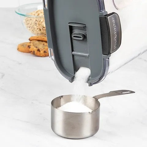 Sugar Being Poured in Measuring Cup