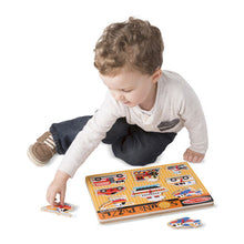 Child putting puzzle together.