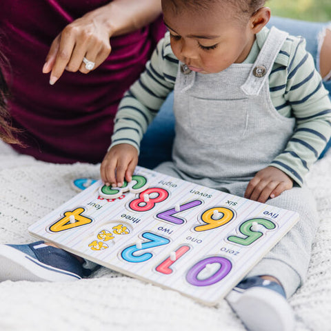 Child putting puzzle together