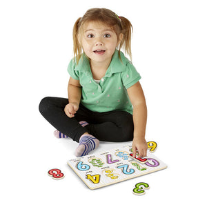 Child putting puzzle together