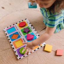 Child putting puzzle together