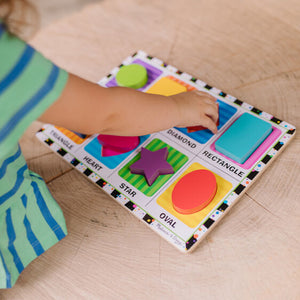 Child putting puzzle together