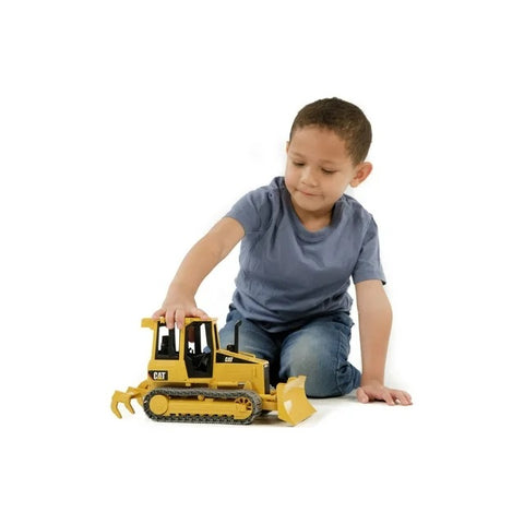 Boy Playing with CAT Track Type Tractor