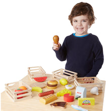 child with wooden food set