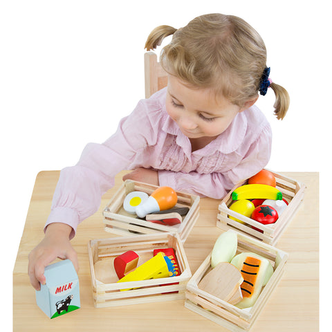 child sorting food into crates