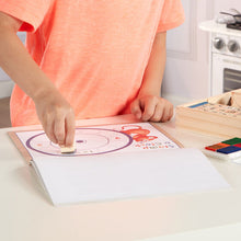 Stamping onto activity pad.