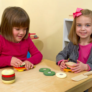 children assembling wooden sandwiches