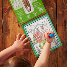 child painting with water on the go farm pad activity