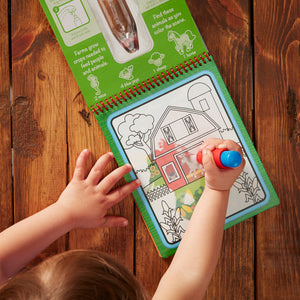 child painting with water on the go farm pad activity