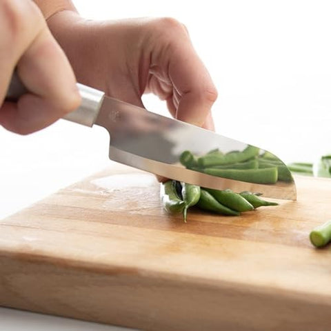 Cook's Utility Knife DR140 chopping up green beans on cutting board