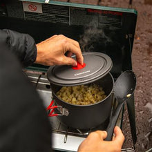 man cooking with cookware