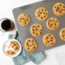 Nordic Ware Naturals cookie slider insulated baking sheet in use with cookies on it