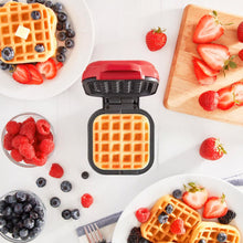 Red Plastic Mini Waffle Maker RMW001GBSK06 displayed with waffles and fruit