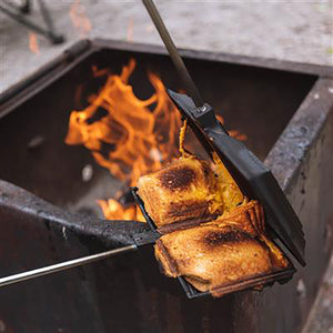 toasting sandwiches over fire