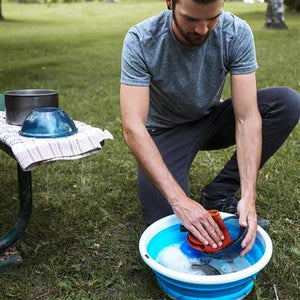 man washing dishes in Collapsible Sink 2082