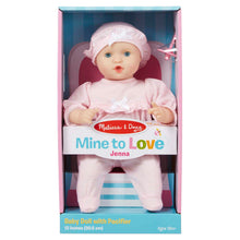 Melissa and Doug Jenna Doll wearing pink outfit inside box. 