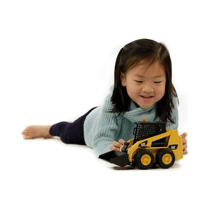 Girl Playing with Skid Steer Loader