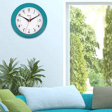 Analog Teal Wall Clock 25020 displayed on wall