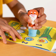Child Stamping with Pumpkin the Tiger Sticker Stamper