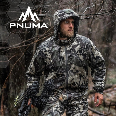 Hunter wearing Pnuma men's 3L Element Proof Camo Rain Jacket