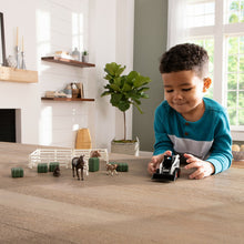 Little Boy Playing with Set