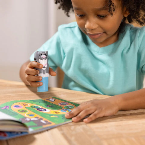 Child Stamping with Tuna the Cat Sticker Stamper
