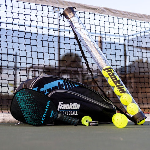 Franklin 2-player Activator Wood Pickleball Paddle & balls on a court