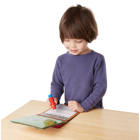 child writing with water pen