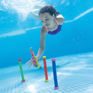 Girl Retrieving Play Sticks from Pool Bottom