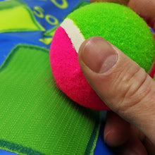 ball sticking onto dart board