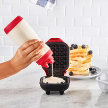 Clear Plastic Red Mini Batter Bottle RBB500GBRR16 with waffle batter pouring out of one tip