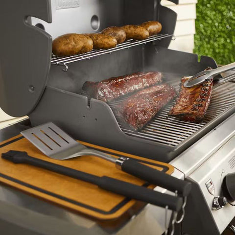 Tongs Holding Meat