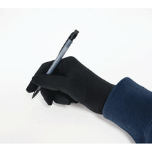 gloved hand writing with a pen
