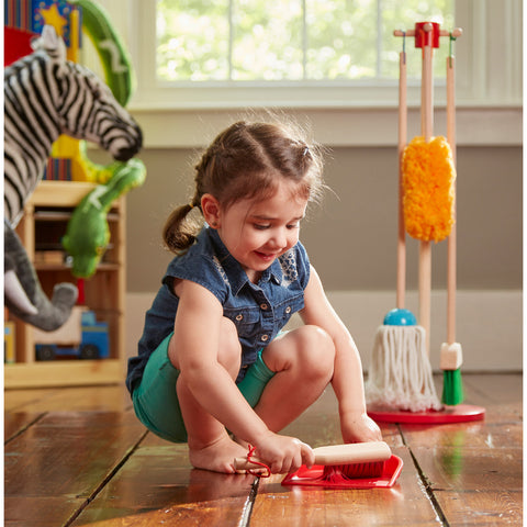 girl with dustpan and brush