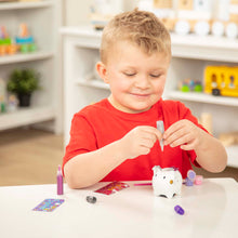 boy decorating pig