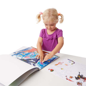 girl creating bible story with stickers