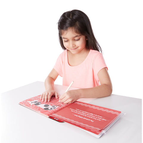 girl with scratch art pad
