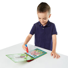 boy using water wow farm pad with water pen
