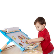child with farm magnets