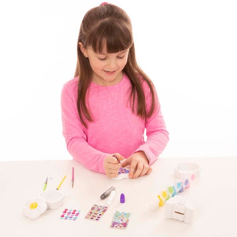 girl using bank decorating supplies