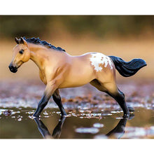 toy horse in puddle