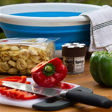 spice container sitting on outdoor table of food