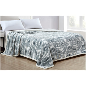 Gray Alaska sherpa blanket on a bed