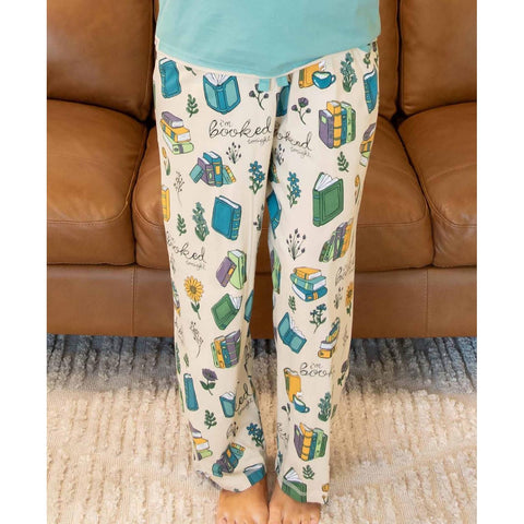 Woman wearing Lazy One Booked women's pajama pants