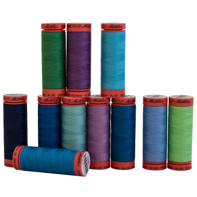 Mettler Metrosene polyester thread in assorted cool colors.