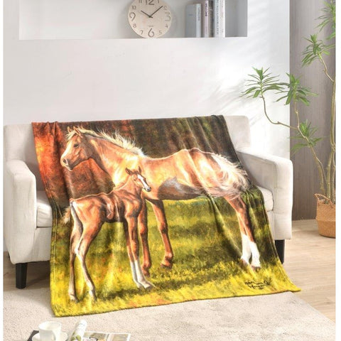 Regal Comfort Horse & Foal Throw Blanket on sofa