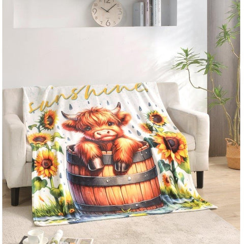 Regal Comfort Hello Sunshine Highland Calf Throw Blanket on sofa