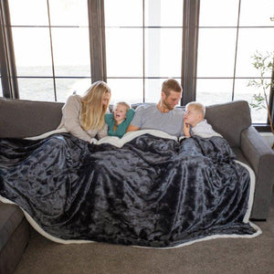 Family Sitting Together on Couch with Brushed Slate Family Blanket